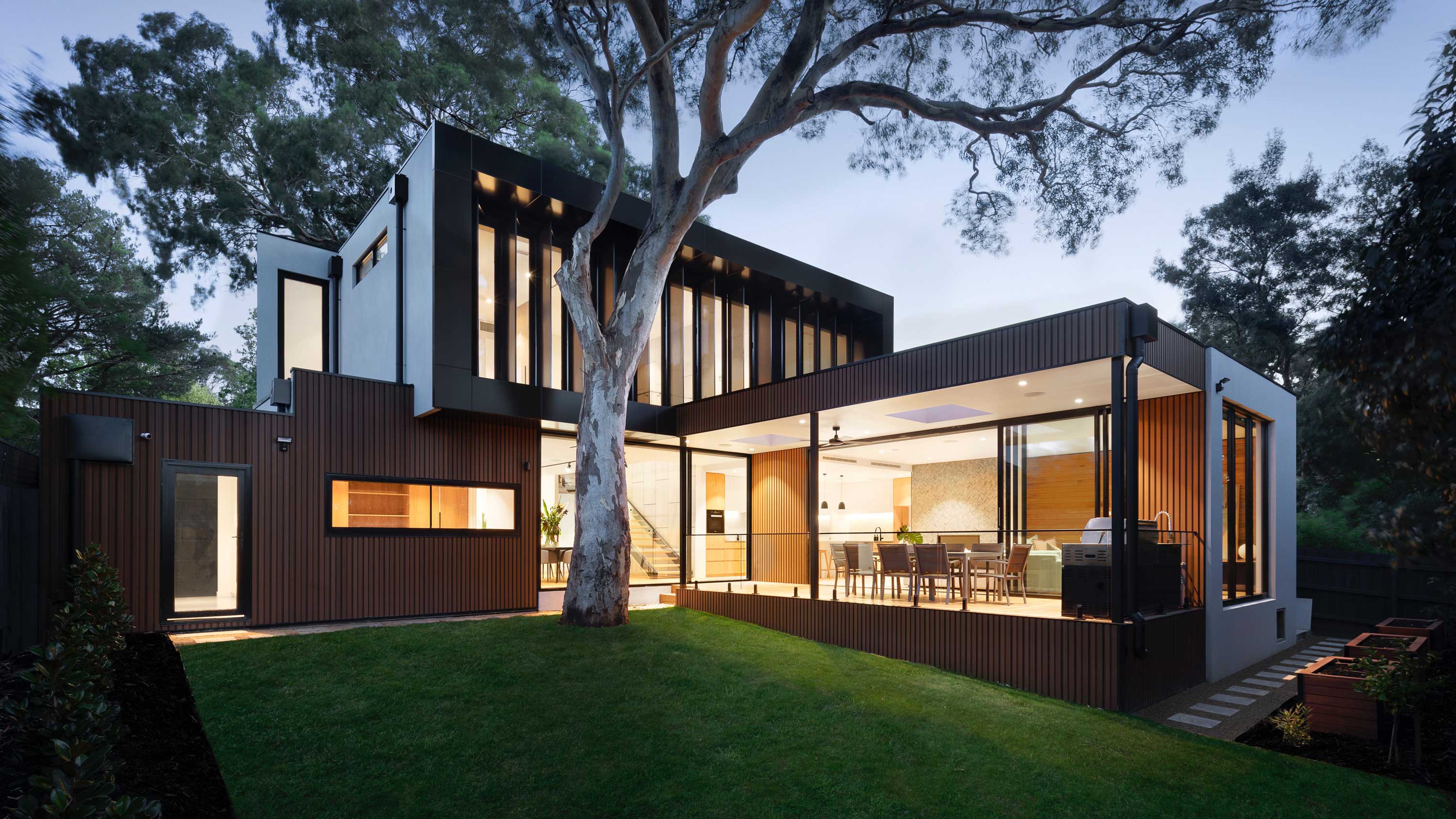 image of home lit up at dusk